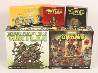 Lot 22 - IDW Games - Teenage Mutant Ninja Turtles Board Games & Accessory Upgrade Packs.